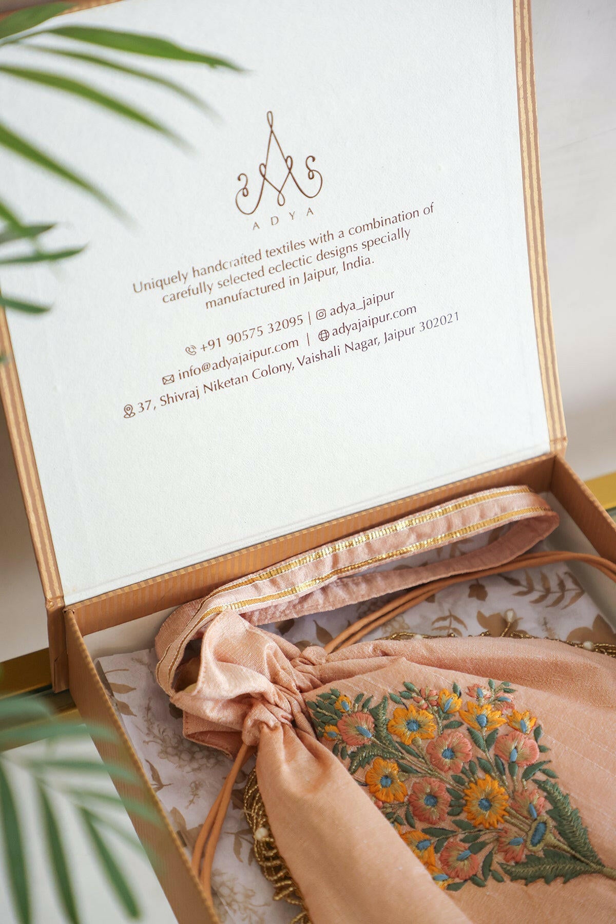 Off White Embroidered Raw Silk Potli Bag